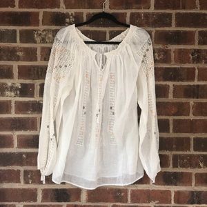 Cream tunic blouse with crochet flower detail